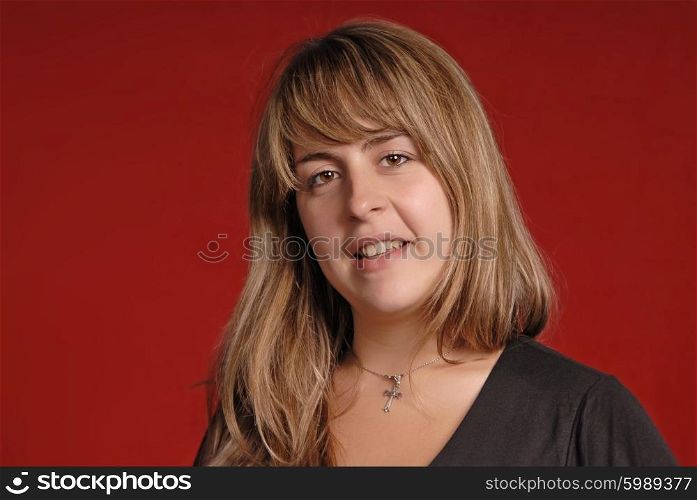 young casual woman portrait on red background