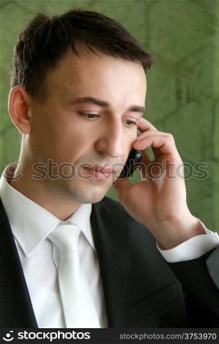 Young caucasian business man on the phone