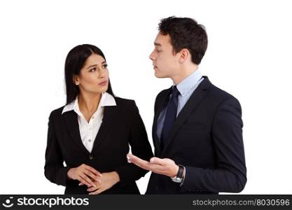 Young Caucasian business man talking to a business woman disapprovingly. A young Caucasian business man is talking to a business woman disapprovingly. She is frowning while looking at him.