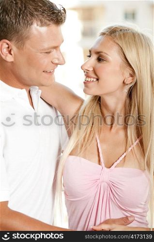 Young caucasian couple looking at each other