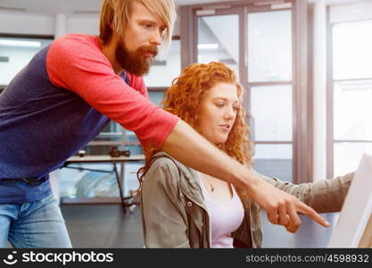 Young caucasian couple standing in a gallery and contemplating artwork. Young caucasian couple standing in a gallery and contemplating abstract artwork