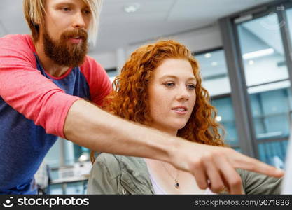 Young caucasian couple standing in a gallery and contemplating artwork. Young caucasian couple standing in a gallery and contemplating abstract artwork