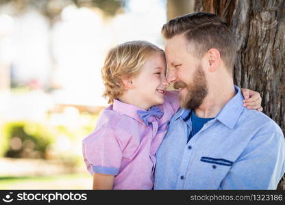 Young Caucasian Father And Son Portrait At The Park.