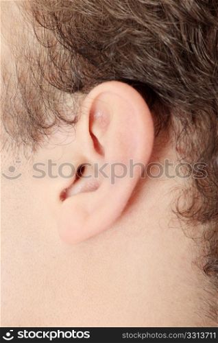 Young caucasian man ear closeup.