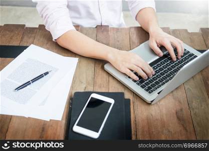 young caucasian man working at home planning work writing note on some project with his laptop on a desk, strartup business, e learning concept.
