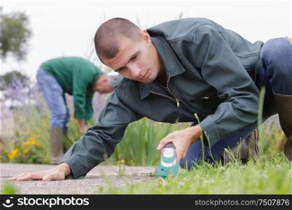 young caucasian man working in garden
