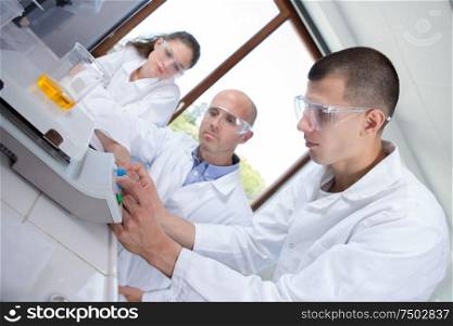 young caucasian scientists studying a molecular structure in a laboratory