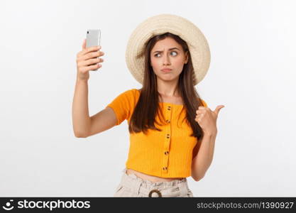 Young Caucasian woman enjoying the selfie with herself isolated on white background summer travel concept. Young Caucasian woman enjoying the selfie with herself isolated on white background summer travel concept.