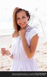 young Caucasian woman holding white umbrella