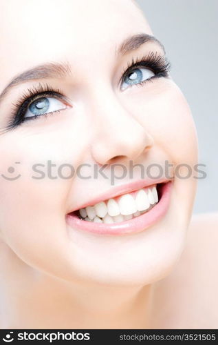 young caucasian woman smiling happily, beauty shot