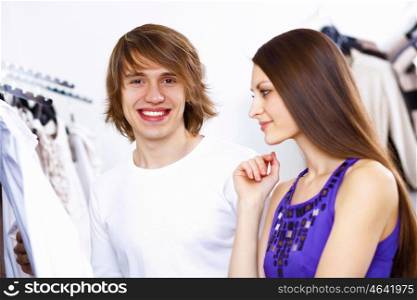 Young caucausian couple doing clothing shopping together