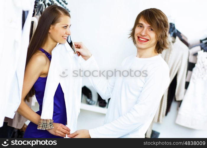 Young caucausian couple doing clothing shopping together