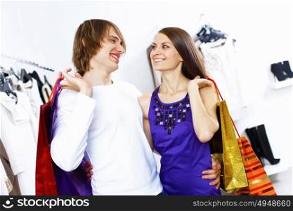 Young caucausian couple doing clothing shopping together