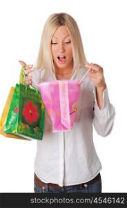 Young charming blonde holding colorful shopping bags