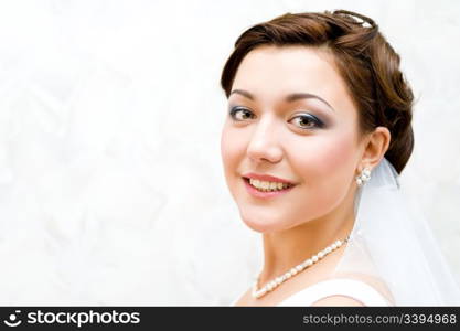 young charming bride looks into camera, closeup
