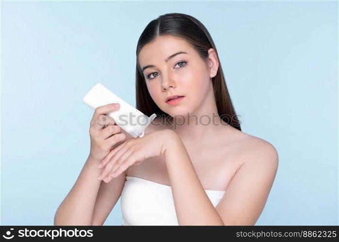 Young charming girl with natural beauty, perfect smooth skin hold lotion, cream, moisturizer tube. Beautiful girl show skincare product smiling on isolated background.. Young charming girl with natural beauty hold lotion tube.l