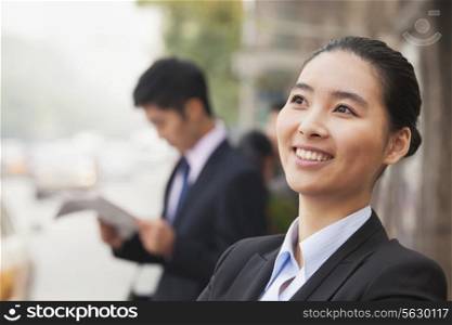 Young Cheerful Businesswoman in Beijing, China, portrait