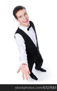 Young cheerful male waiter showing something - isolated on white