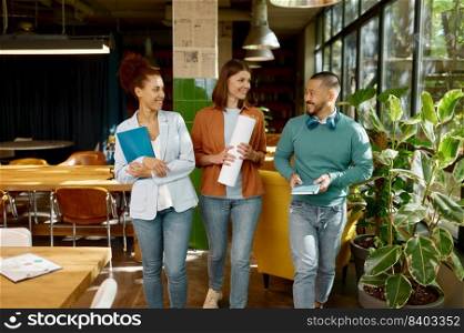 Young cheerful mixed race coworker team. Group of happy multiethnic business people meeting in office workplace. Young cheerful mixed race coworker team in office