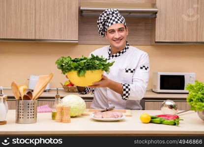 Young chef working in the kitchen