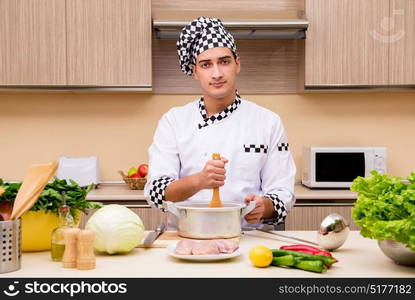 Young chef working in the kitchen