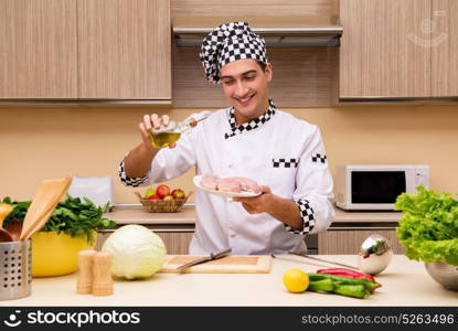 Young chef working in the kitchen