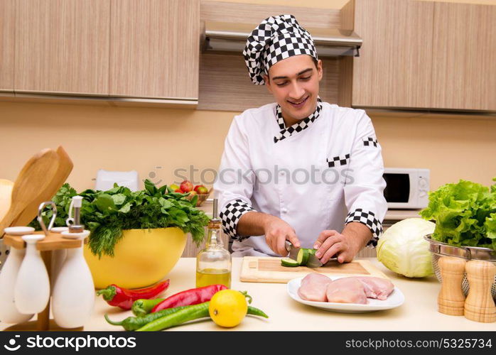 Young chef working in the kitchen