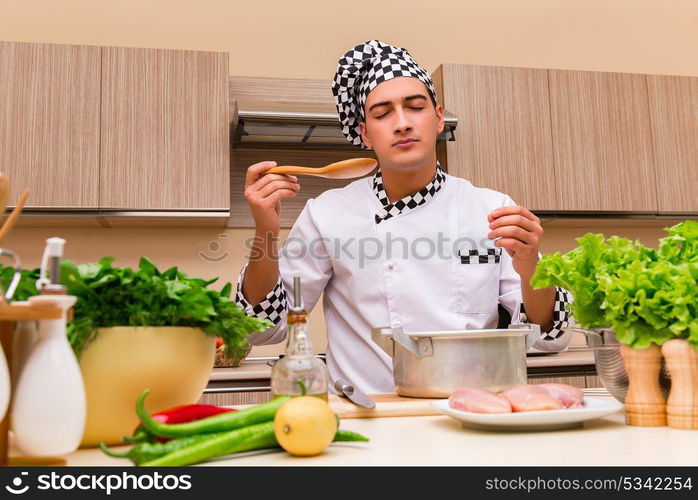 Young chef working in the kitchen