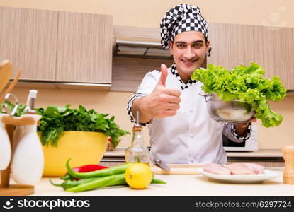 Young chef working in the kitchen