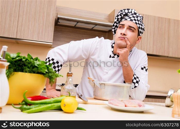 Young chef working in the kitchen