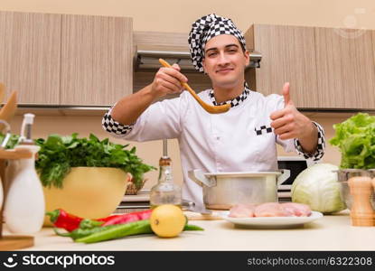 Young chef working in the kitchen