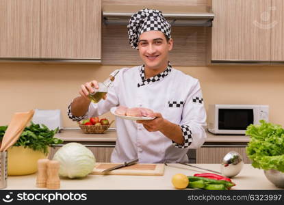 Young chef working in the kitchen