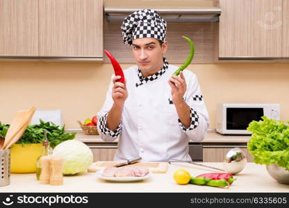 Young chef working in the kitchen