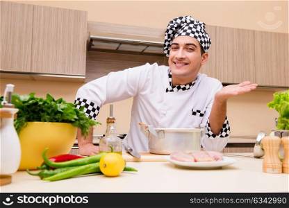Young chef working in the kitchen