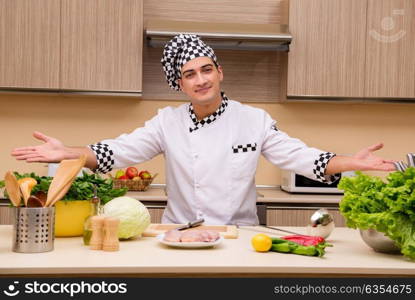 Young chef working in the kitchen