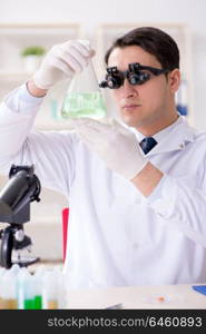 Young chemical scientist working in lab