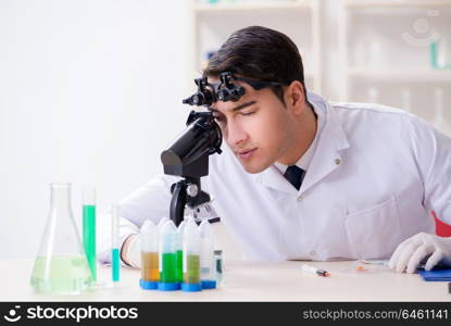 Young chemical scientist working in lab