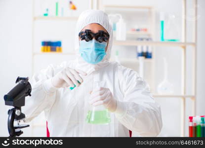 Young chemical scientist working in lab