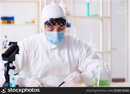 Young chemical scientist working in lab