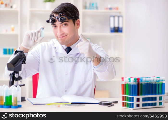 Young chemical scientist working in lab