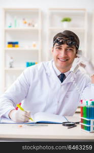 Young chemical scientist working in lab