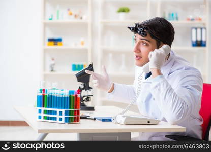 Young chemical scientist working in lab