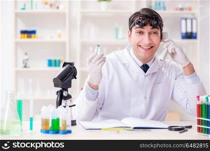 Young chemical scientist working in lab