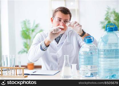 Young chemist student experimenting in lab
