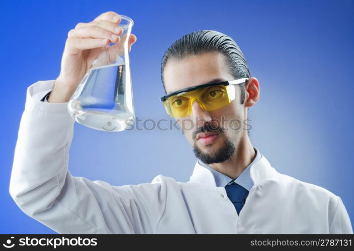 Young chemist student working in lab