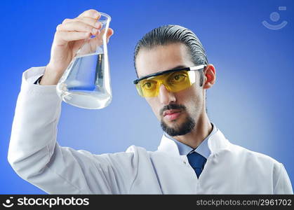 Young chemist student working in lab