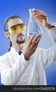 Young chemist student working in lab