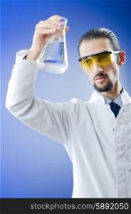 Young chemist student working in lab