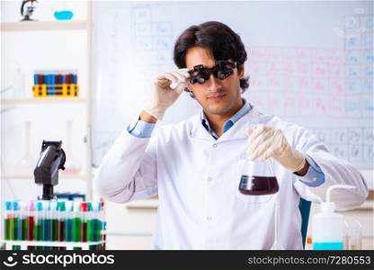 Young chemist working in the lab 