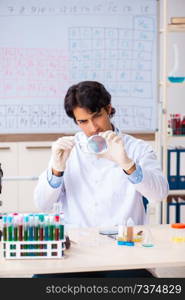 Young chemist working in the lab 